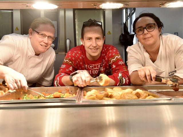 Beacon View Primary Academy in Paulsgrove held their annual community Christmas lunch on Friday, December 22.Pictured is: (l-r) Cherri Hunt, Paul Reader and Katy Hickman, kitchen manager.Picture: Sarah Standing (221223-4083)