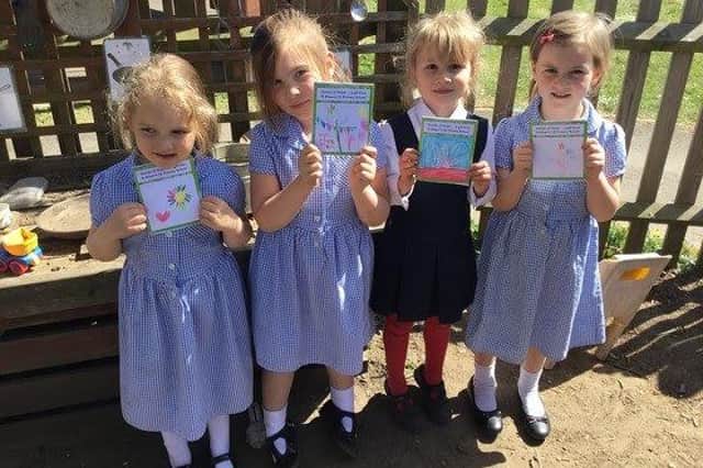 Pupils at St Alban's C of E Primary School show their work