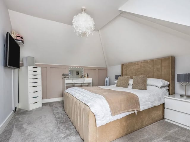 The listing says: "Easily one of the most surprising, deceiving and fantastic homes I’ve ever listed... This extended four bedroom detached chalet home, occupies a plot and a half, with the current owners having brought an additional garden... Creating the party space and garden of dreams."
