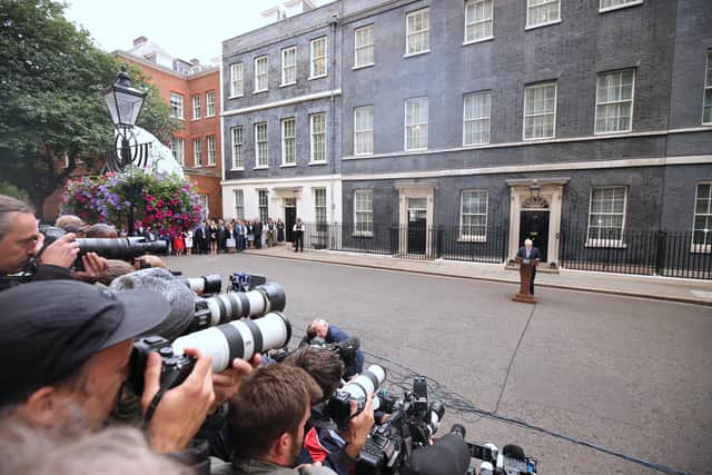 Prime minister Boris Johnson reads a statement outside 10 Downing Street
