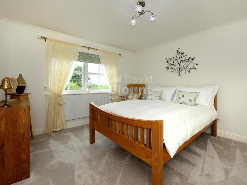 Another visually appealing double bedroom. Again it includes three sets of built-in double wardrobes.