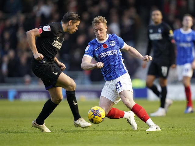 Jack Sparkes attempts to get past Charlton midfielder George Dobson