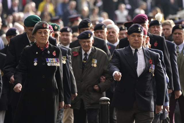 Veterans march towards the City of Portsmouth War Memorial