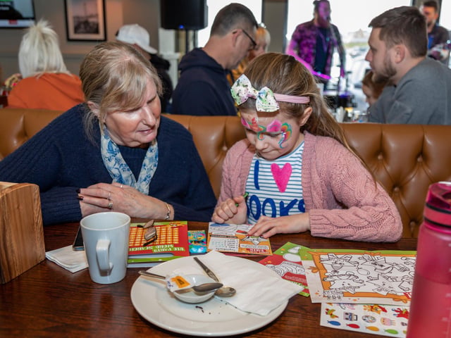 Emily Richards (7) with grandmother Jane McAree during the launch party at the Brewers Fayre. Picture: Mike Cooter (040323)