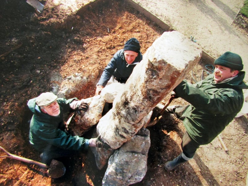 Maintenance staff (clockwise) Chris Roser, Bill Samways and Jim Tann, place the large stones from the Falkland Islands, to form part of the outdoor memorial to the Royal Marines. 26th January 1996