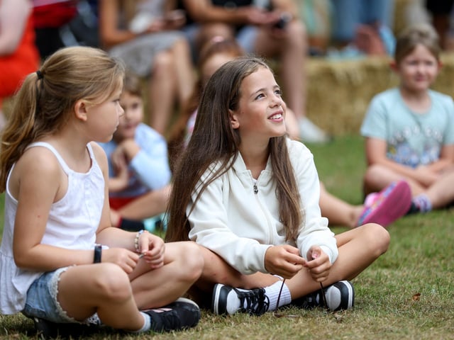Children enjoying the performance by Silly Scott.