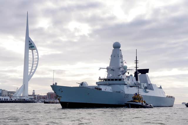 HMS Dragon returned home to Portsmouth from eight months on operations in the Indian Ocean and Eastern Mediterranean. The warship will feature in the new James Bond film when it is released later this month. Photo: Royal Navy