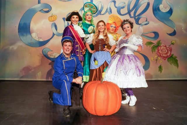 Emily Day, centre, as Cinderella with Lucy Andic as Prince Charming, second left, with their fellow leads in Cinderella at New Theatre Royal, Portsmouth. Picture: Matthew Clarke