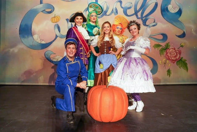 Emily Day, centre, as Cinderella with Lucy Andic as Prince Charming, second left, with their fellow leads in Cinderella at New Theatre Royal, Portsmouth. Picture: Matthew Clarke