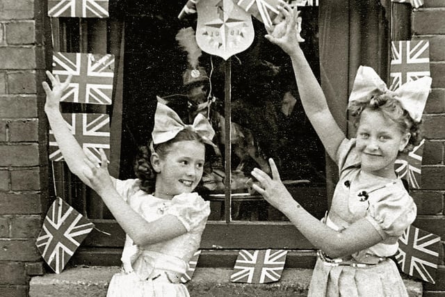 Festival of Britain street tea outside 14, Moorland Road Buckland Portsmouth. Kay Britno 9yrs on left & friend from Madame Selwood's dance troop
outside her grandparents house entertaining the neighbours at a Festival of Britain street party in 1951