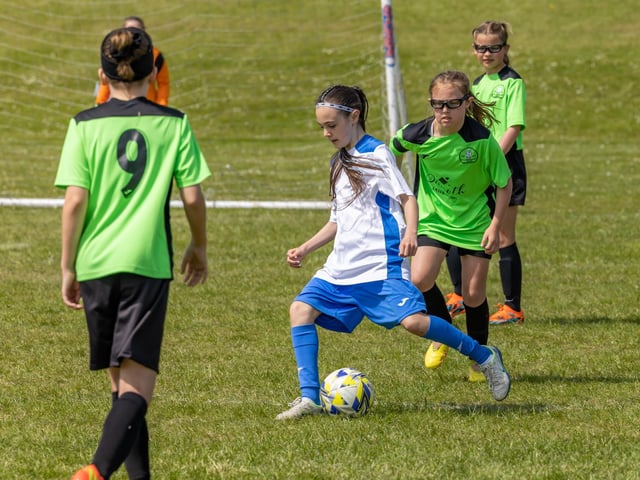 Bedhampton Eagles U11s (green kit) up against Downgrange Wildcats (white kit) in the Clanfield youth football tournament at Horndean Technology College. Picture: Mike Cooter