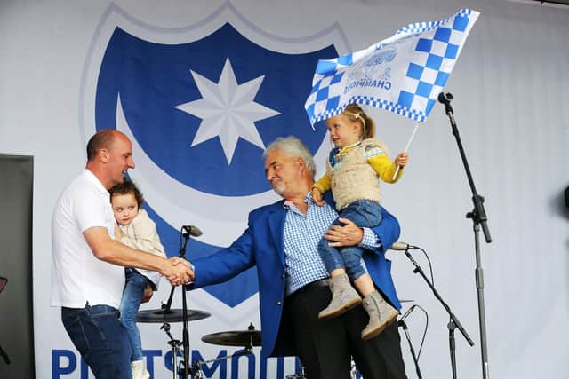 Paul Cook and Iain McInnes commemorate Pompey's League Two title win on stage at the Southsea Common celebrations in May 2017. Picture: Joe Pepler
