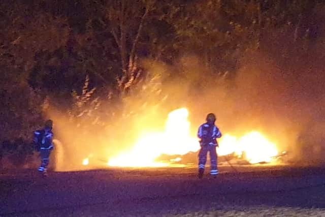A caravan was destroyed in a fire at Port Solent where a traveller encampment sprang up. The fire on August 5 was tackled by Cosham and Portchester crews. Picture: Portchester fire station