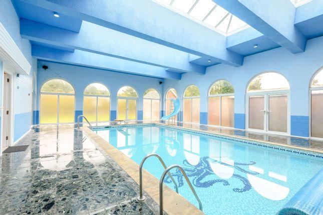 This beautiful heated pool is part of a spa complex with sauna at a £3 million country mansion with stabling,  six bedrooms and it's own lake