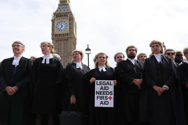 Barristers gather outside Parliament in support of industrial action by the Criminal Bar Association (CBA), in London on September 6, 2022. Picture: Adrian DENNIS / AFP.