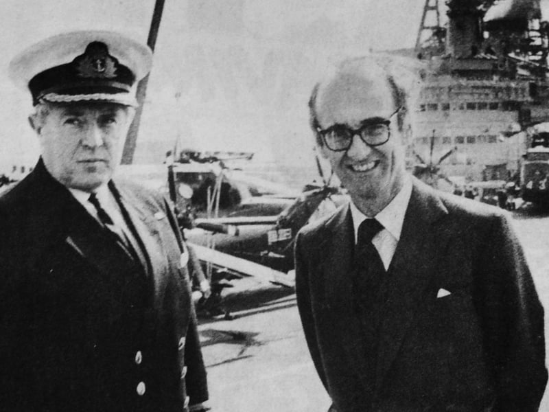 Defence Secretary John Nott with the captain of HMS Hermes, Capt Lyn Middleton, RN, pictured at the top of the Harrier jet ski-ramp at the bow of the aircraft carrier during the minister’s visit to Portsmouth Naval Base
