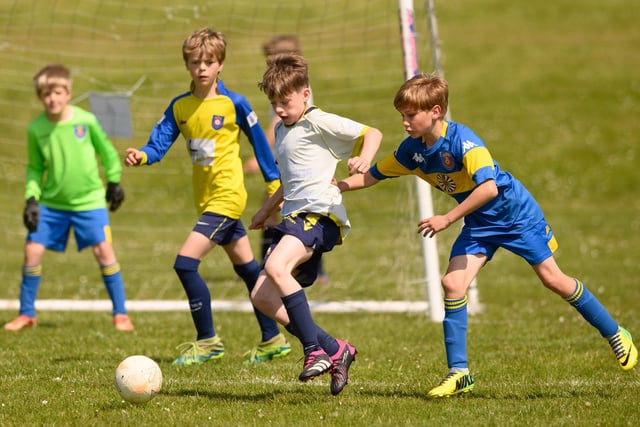 Action from the Clanfield youth football tournament at Horndean Technology College. Picture: Keith Woodland (270521-350)