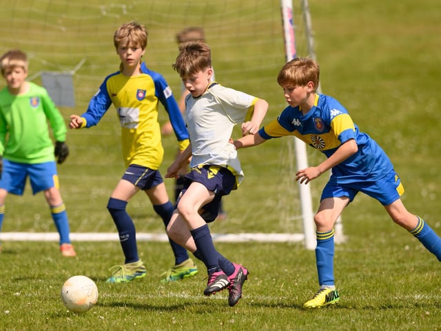 Action from the Clanfield youth football tournament at Horndean Technology College. Picture: Keith Woodland (270521-350)