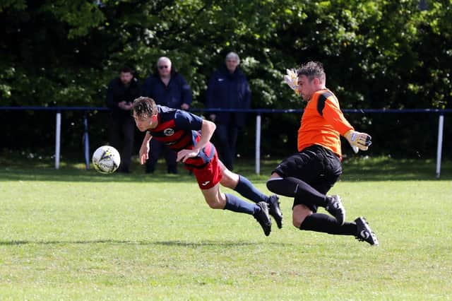 Zac Willett beats the Liphook keeper to head in the second of his three goals. Picture: Sam Stephenson