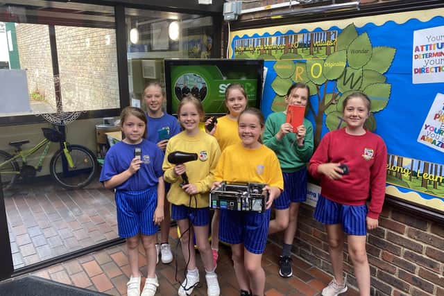 Pupils at Bosmere Junior School with some of the items left for recycling during the Electrical Amnesty Week.