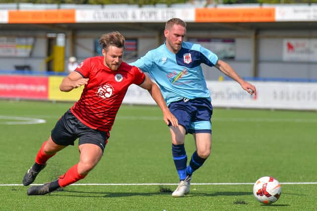 Ben Chamber (left) in cup final action against Bush Hill. Picture: Martyn White