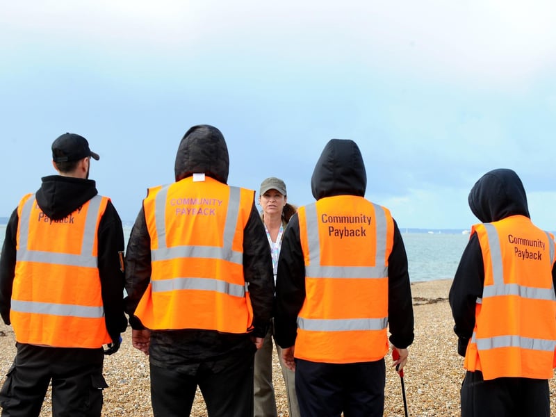 Minister Damian Hinds for prisons, parole and probation, visited a community payback project on Hayling Island on Thursday, September 21, where offenders took part in the Great British Beach Clean to repay their debts to society while also tangibly benefitting the environment and their local communities. Pictured is: (middle) Emma Gelson, planning co-ordinator for South Central Probation Service.Picture: Sarah Standing (210923-1745)