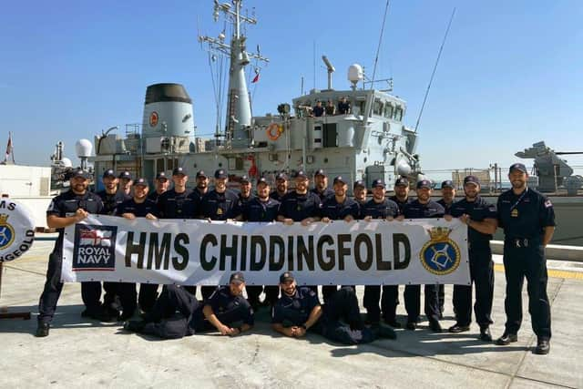 The crew of HMS Chiddingfold pose in front of their ship following a charity fundraiser for The Rainbow Centre in Fareham. Photo: Royal Navy