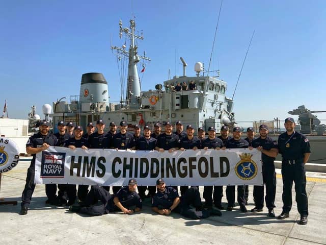 The crew of HMS Chiddingfold pose in front of their ship following a charity fundraiser for The Rainbow Centre in Fareham. Photo: Royal Navy