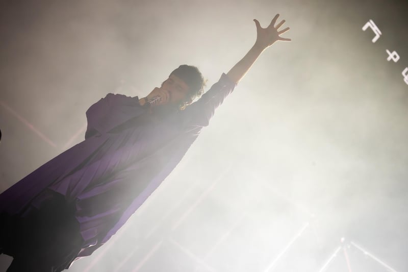 Kasabian frontman Sergio Pizzorno went into the crowds and climbed up a ladder at one stage during the performance. Photo by Alex Shute