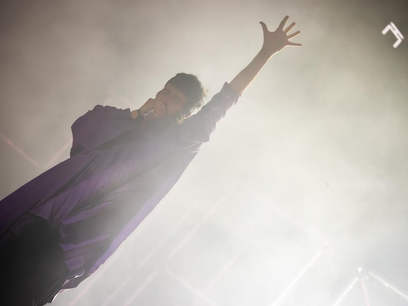 Kasabian frontman Sergio Pizzorno went into the crowds and climbed up a ladder at one stage during the performance. Photo by Alex Shute