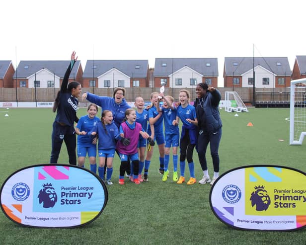 Solent Junior School winning football team joined by Portsmouth FC Women at the Premier League Primary Stars U11 Girls Tournament at Pompey in the Community's John Jenkins Stadium