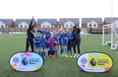 Solent Junior School winning football team joined by Portsmouth FC Women at the Premier League Primary Stars U11 Girls Tournament at Pompey in the Community's John Jenkins Stadium