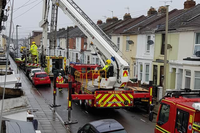 Fire services spotted using an aerial ladder platform to assist in extracting a person from a house in Westfield Road, Eastney