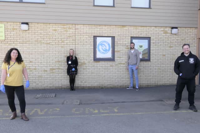 Portsmouth player Christian Burgess visited Hayling Island to help the staff and coaches from Heart of Hayling Boxing Academy deliver prescriptions to people in the community. Pictured left to right: Michelle Buglass, Wendy Ball, who set up the Hayling Helpers, Christian Burgess and Mark Coates from Heart of Hayling