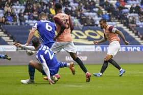 Pompey skipper Marlon Pack in action at Wigan before being injured in the challenge which saw Charlie Wyke sent off. Pic: Jason Brown.