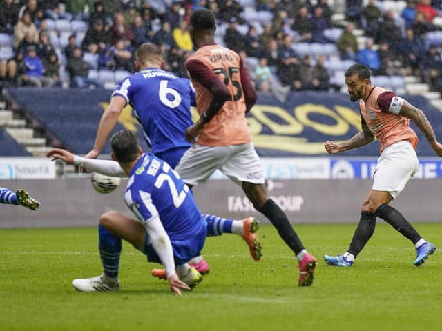 Pompey skipper Marlon Pack in action at Wigan before being injured in the challenge which saw Charlie Wyke sent off. Pic: Jason Brown.