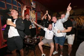 Celebrations at full-time. Fans watch England v Ukraine in the quarter finals of Euro 2020, in The Kings pub, Albert Road, Southsea. Picture: Chris Moorhouse (jpns 030721-22)