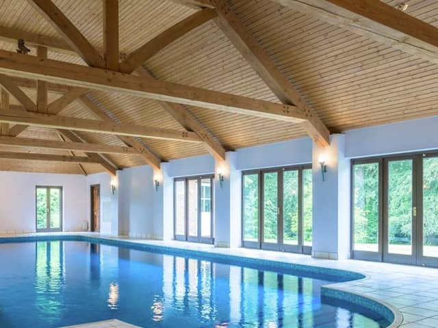 This property comes with seven bedrooms, six bathrooms and four reception rooms.