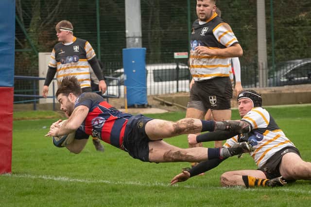 US Portsmouth's Bailey Barnes goes flying over for his first of two tries in the win over Portsmouth 2nds. Picture: Keith Woodland