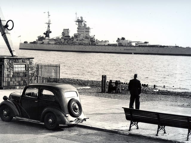 Clarence Esplanade, with only a single man as an audience for the battleship HMS Nelson. Taken by a News photographer in the 1930's.