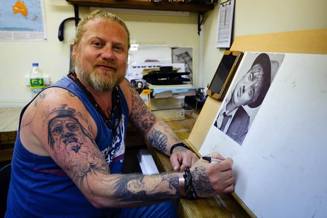 Dan Williams' business could end up in ruins after his Facebook account was hacked. Pictured is: Dan Williams at easel were creates his unique artworks. Picture: Keith Woodland (170621-3)