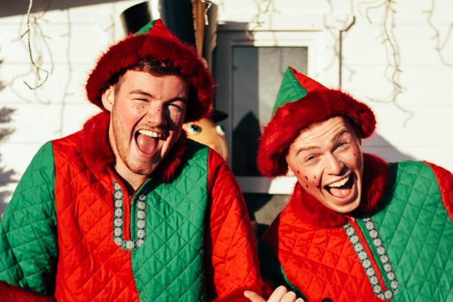 Two elves in the Christmas Village at Seal Bay in Selsey