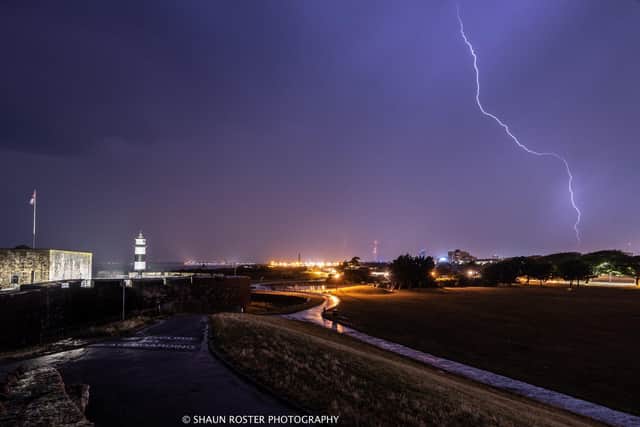Lightning strike captured in the sky above Portsmouth during a storm.