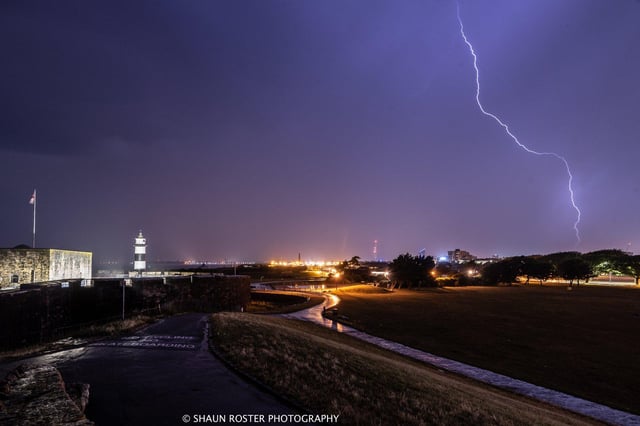 Lightning strike captured in the sky above Portsmouth during a storm.
