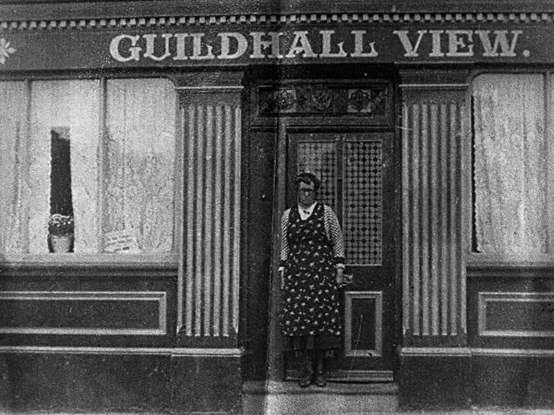 Annie Byng (nee Creamer) outside her transport cafe the Guildhall View in the city centre.