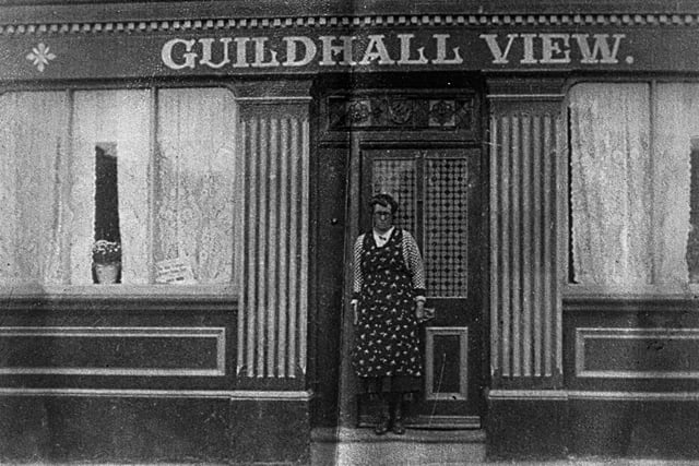 Annie Byng (nee Creamer) outside her transport cafe the Guildhall View in the city centre.