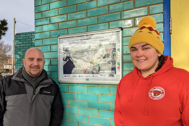 Councillor Steve Pitt and Sarah Shreeve with a stormwater release sign. Picture: Portsmouth City Council.