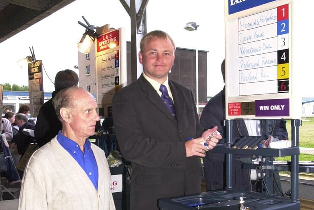 Bookmaker - Ian Kilsby at his betting stall in Portsmouth Greyhound Stadium in 2001. Picture: Mike Scaddan. 012884_0067
