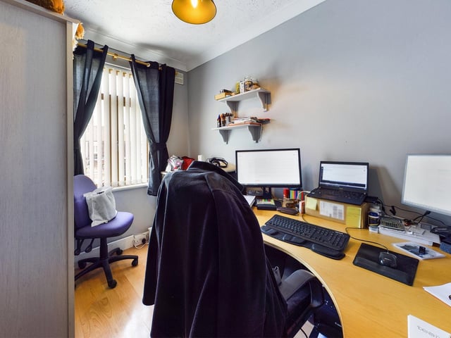 One of the three bedrooms is currently an office