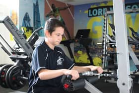 A student working hard in the school's new gym.
